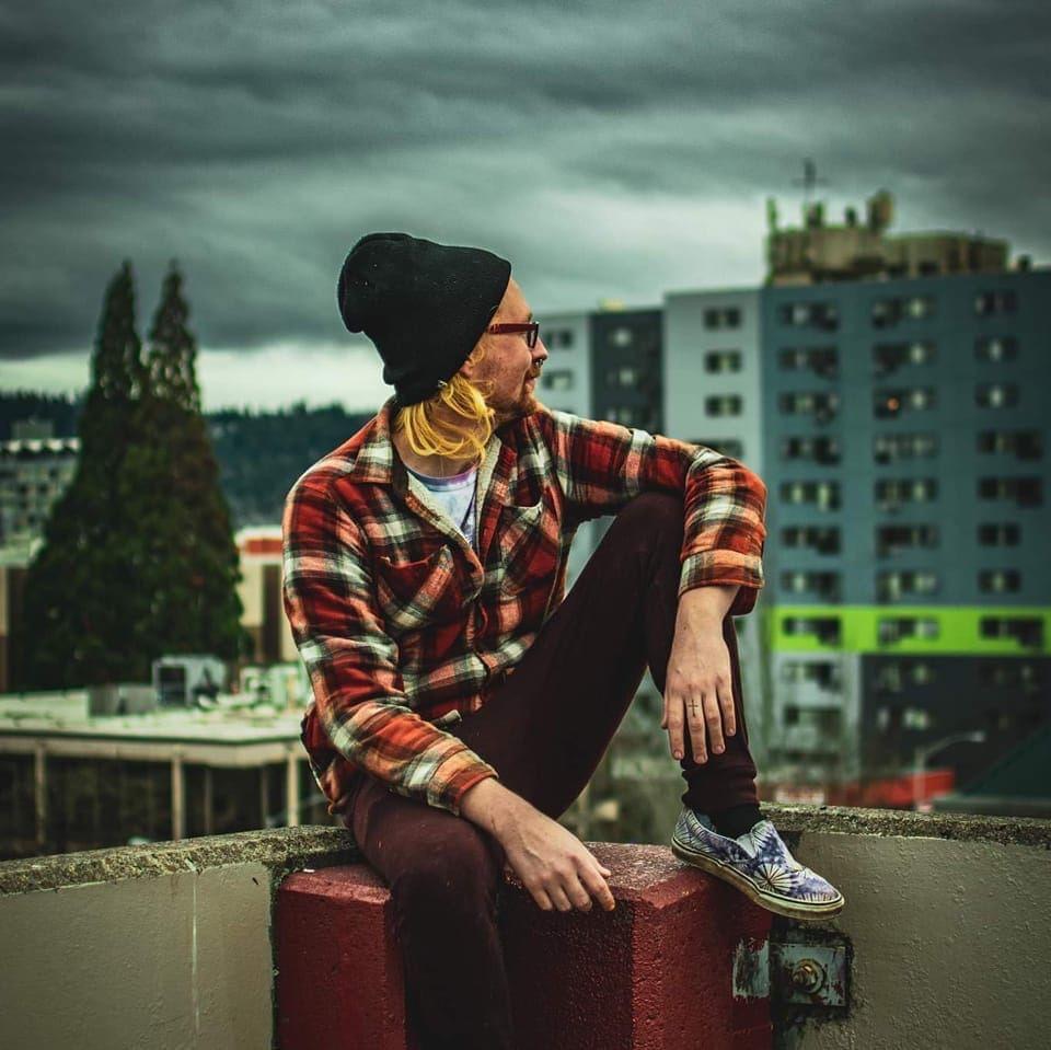 mike sitting on a ledge